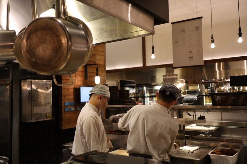 Pizza luce team preparing food in kitchen